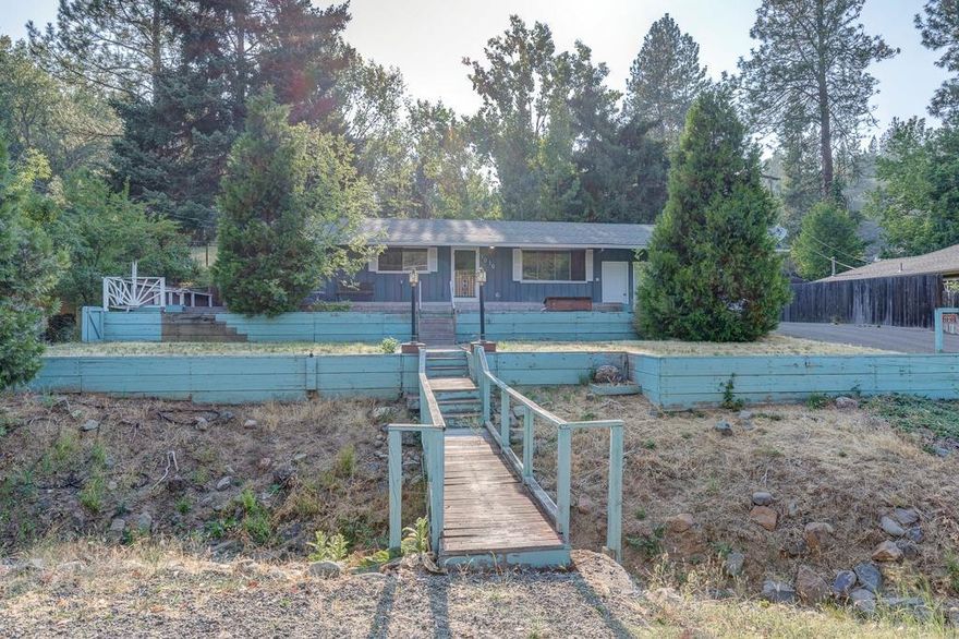 Location location location! Check out this charming 3 bedroom home in the heart of Jacksonville. It sits on a huge lot that is over a quarter of an acre. It's within close proximity to the Britt Gardens, the park, and downtown Jacksonville. The backyard features a covered deck that's perfect for entertaining your guests. There's also a deck in the front yard to relax, read, or enjoy a hot cup of coffee in the cooler months! The home has an attached two car garage and also has a small shop in the back and enough room to park an RV. Don't miss out on this awesome opportunity! Get it before it's gone!