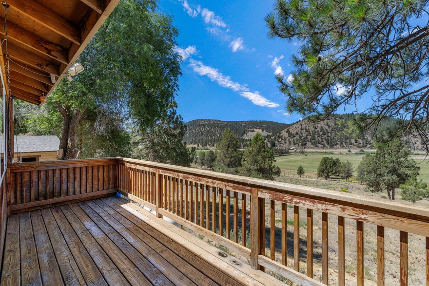 VERY MOTIVATED SELLER!  Acreage & views!!  Great Horse Property! This charming 3 bedroom, 3 bath home on 18.7 acres along Mill Creek Road in Prineville offers the perfect mix of comfort and rural living. The home features 2 primary bedrooms, a spacious kitchen with a double drawer dishwasher, and breathtaking views from every window. With 2 full bathrooms and a functional layout, it's ideal for family living or hosting guests. The property is fully perimeter fenced and includes a corral and chute, making it perfect for livestock. A tack room, large garage, plus a detached garage and an RV dump add to the convenience. You'll also find a bunk house with heat and electricity- ideal for extra guests or as a private retreat. Whether you're looking to farm, raise animals, or simply enjoy your space, this property provides it all. The serene setting, combined with easy access to Prineville's amenities, makes it the perfect place to call home.