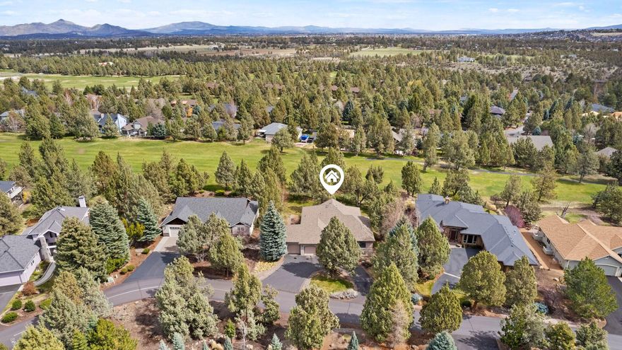 An enviable lifestyle awaits you in this single level home set on the golf course in Eagle Crest Resort.  This one-owner home was custom designed and has been impeccably cared for. The efficient and flowing plan boasts an open, airy feel with loads of natural light flooding through a wall of windows.  A quaint front courtyard with covered sitting porch is the perfect spot for morning coffee or retreat to the large back deck to entertain or relax and take in the peaceful golf course setting.   The kitchen serves as the heart of this home as it's adjacent to nearly every other room creating an engaging way of life.  The useable flat yard is enhanced by mature manicured landscaping.   Other perks include gorgeous wide planked wood floors, custom wood built-ins,  jetted tub, a 3-car garage and AC.  Come play on one of the three 18-hole golf courses, hike miles of nearby trails, or stay active at one of three sport centers and don't forget the pickleball courts! Easy living awaits you!