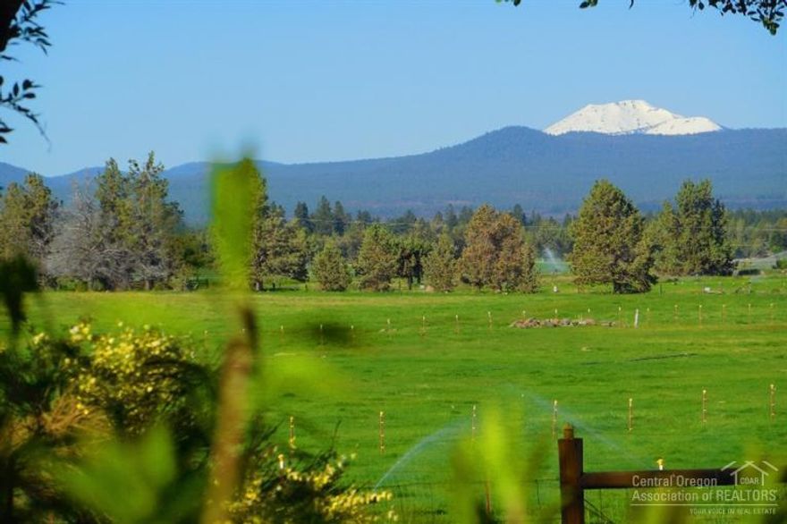Panoramic Cascade Mountain range views throughout this 9.3ac property & home! Located in close-in West Tumalo w9 ac irrigation, K-Line system & farm deferral. It is wonderfully quiet, private and very convenient to Bend. Completely remodeled 2,716 sqft home w/3 bdr 3 ba, heated travertine floor, granite & hardwood. Enjoy outdoor living from the large deck & flagstone patio or relax @ the spa w/paver patio all with stunning views. A detached 48x40 3 bay shop w/concrete floors. Nice ponds & canal.