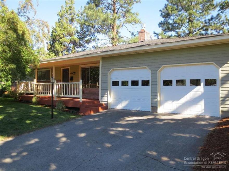 Great mid-town location! This adorable home has tons of character w/hardwood floors, wonderful gas fireplace with Xtrordinair insert, wainscoting in dining area, 3 bedrooms, and a spacious fenced backyard. Furnace replaced in 2013, fresh paint, newer water heater, updated bathrooms, new garage doors, new patio door, new kitchen countertops, hardwood floors recently polished. Extra insulation was added to keep it nice and warm in the winter months. Great opportunity...don't wait!