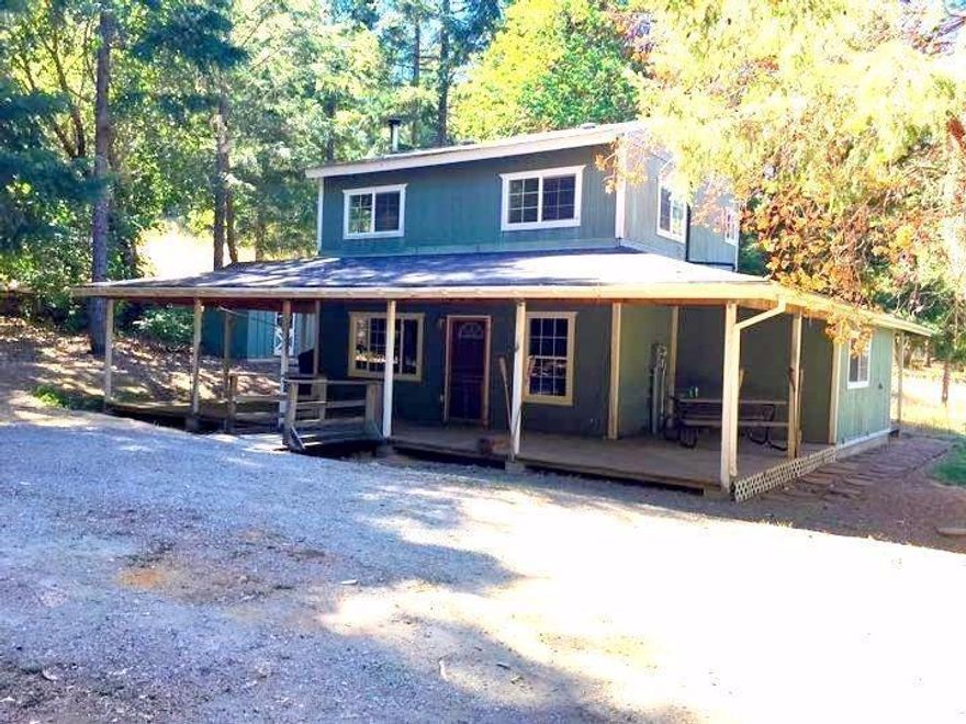 Story book cottage on over 5 almost all level treed acres. Some meadows and pastures, good well, Large horse barn with stalls, and a shop. Access down a long private driveway. With some fencing would make nice horse set up or family farm.great country kitchen and hardwood floors with complete wrap around porch.This is what you are looking for. Perfect for farming, great horse set up and potential for a grow site.