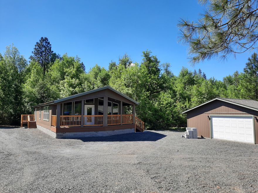 Beautiful Quite, & Private 1.56 acre site on edge of Town,with Year around creek through property. Wonderful view of
Mts and Irrigated fields. View of Mt Mclaughlin.drive of back in your side by side and go for miles in Mts. Covered lighted Deck on front of home for outside entertaining ,New upgrade
Manufactured Home. 3 bdrms 2 ba. Large windows, sliding glass doors out to deck in Master bedroom . large Master bath with
walk in Shower and seprate large soaking tub. 20x24 Garage . Private yard   and garden area backs up to
wooded area that city of Butte Falls is buying to keep as a wooded buffer area. Fronts on new paved road. Large rocked area
for RV parking. One owner is Oregon Lis Real Estate Broker