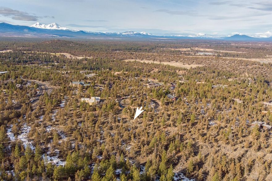 Don't pass up this opportunity to build your dream home in North Rim, one of Northwest Bend's premiere communities featuring gated entrances, three miles of paved walking paths, tennis courts, a park, and the one-of-a-kind North Rim Lodge. East side of the lot adjoins public land with trails offering direct access to the Deschutes River Trail. Perfect for nature lovers while being just a short trip from downtown. One of few North Rim lots remaining in this price range--don't wait!