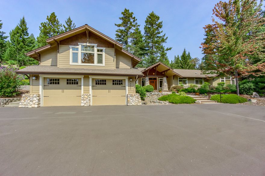 Rare find on Old Military Rd on 6.11 acres. Level & rolling w/beautiful Evergreens & mature landscaping w/night lighting. Craftsman detail w/Korbels & open beam ceilings, river rock columns, paved circle electric gated entry. Grand entry door w/stamped stained cement. 4 bdrm, 4 baths, 3996 SQFT Home is fully updated & remodeled. Hardwood hand scraped pecan floors w/slate inlays. Living rm w/river rock floor to ceiling wood burning fireplace, lg built in bookcases, French doors to back yard. Kitchen w/custom cabinets, dbl ovens, 6 burner cook top w/ griddle, granite counters w/tile backsplash, prep sink /w island & walk in pantry. Family rm w/boxed beam ceilings, breakfast rm w/ door to covered patio, gunite pool, paver patios, raised garden beds & climate controlled green house. 2 master suites, 1 w/fireplace, French doors, sitting area, dbl sinks, soaking tub & lg tile shower. Laundry/hobby room. 40X80 Barn/Shop w/16' doors on each side + a lg 2 car Shop/finished office, RV Parking.