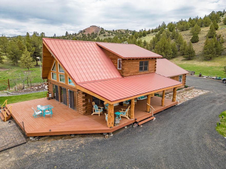 SELLER VERY MOTIVATED. Beautiful private income producing ranch with a gorgeous log home, situated on 345 picturesque acres, protected by a security gate at the entrance of the property. The home is completely self-sufficient powered by a state-of-the-art solar system with a propane generator backup. This very warm and welcoming home is a recently remodeled 3 bed, 2 bath with beautiful cabin touches throughout. The home has immaculate landscaping in the front and back yards. Pavers make up large patio areas and walking paths to the gazebos. Peaceful water features can be enjoyed at several locations on these well-manicured grounds. There is a 1 bed, 1 bath, 480 sq. ft. guest cabin constructed with logs sawn from the ranch. 26x16 greenhouse.  The property is ideal for cattle and horses with perimeter and cross fencing.  The barn is 60x48.  Covered hay storage is 60x12.  Round pen and working chutes.  Permanent pasture 130ac.  Several springs and ponds for livestock and game.  Must see