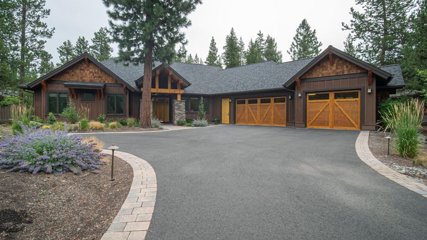 Single-level stunning Pineriver Homes build with a forested common area for privacy in the back of the home. Two primary suites on either side of the home with slab granite counters, heated tile floors, dual vanity sinks & large walk-in closets. The other two bedrooms share a bathroom between the rooms. Additionally, there is a light & bright office and a powder room. The open concept home is great for entertaining. Sold furnished. Large East-facing paver patio with built-in firepit & sunken hot tub. Boasts quality throughout with high-end finishes including a knotty alder trim and cabinet package, chef's kitchen with granite counters, Jenn-Air stainless steel appliances, high vaulted ceilings throughout with show-stopping floor-to-ceiling stone fireplace. Rustic wide plank hardwood floors and 8 ft. solid wood doors. Oversized 3-car garage w/ an additional refrigerator & freezer, workbench, and beautiful built-in cabinets. The utility room is grand with lots of built-in storage