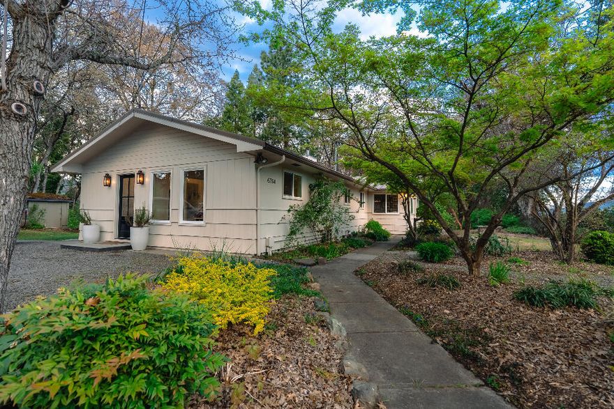 Situated on 7.24 accessible acres, this home incorporates the modern luxuries of a 2020 renovation with the endless outdoor opportunities provided by the TID-irrigated pasture and the canopy-shaded backyard. There are several buildings on the property, including a spacious barn with 3 finished rooms, a cottage complete with a comfortable loft, a coop-style root cellar, a wood shed, and a covered area for recreational storage. This convenient location is a 15-minute drive from downtown Ashland and Medford and a 10-minute bike ride to the heart of Talent. 

Designed for the supervision of children and animals, there are clear lines of sight from the central area of the house through the forested backyard and out to the open pasture, revealing surrounding mountain views and a clear perspective of Medford from the pasture. 

There is a robust solar array and 5,000 gallons of above-ground stored water on the property, which has not received any pest or herbicide application in 10 years