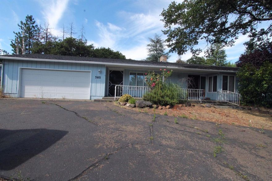 Old East Medford Charm! Large home with unique touches including laminate flooring, vaulted ceiling, oversized rooms, huge walk in closet. Backyard has covered patio and is waiting to be brought back to life.