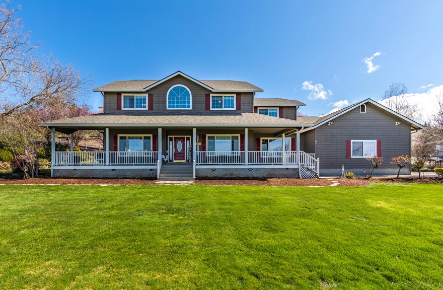 Enjoy the Beautiful views of the Rogue Valley from the front porch of this East Medford home. Amazing custom home featuring hard wood floors, 2 gas fireplaces, formal living room and dining room, large open great room, 5 bedrooms, custom Koi pond, and expansive front lawn. Kitchen features Kitchen Aid double oven, Jenn Air 5 gas burner stove top, Kitchen Aid trash compactor, Whirlpool dishwasher and Kitchen Aid refrigerator, granite tile countertops, oak cabinets and oak flooring. Many new features including roof  (10/20/19), new heating system (09/2020), double oven, attic insulation, new garage door opener, skylights, fresh paint throughout the interior, new wood decking-front porch with fresh paint, updated light fixtures. Dining room has bay window with bench seat/storage and large pantry under stairwell. Upstairs you will find Master suite which offers jacuzzi tub, double sinks, double showerheads and Corian countertops. Large master walk in closet with venting system. RV parking.