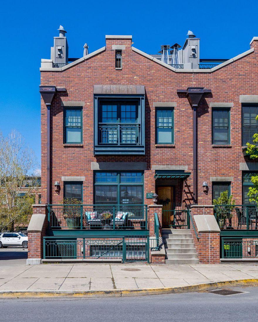 Rare Opportunity in the Mill Quarter! Gorgeous 3721sf Industrial Style Brownstone Townhome in the heart of Bend's vibrant urban scene. Situated in the coveted Mill Quarter, this location provides immediate access to Downtown, Box Factory, Old Mill District, the Deschutes River and trails. Enjoy captivating views of the Cascade Mountains and Pilot Butte, while entertaining your guests on the private rooftop Terrace. Main level boasts a spacious open living area merging seamlessly with a gourmet kitchen equipped with Viking appliances, a beautiful dining area, a 2nd family room and terrace. Primary suite features walk-in closet, luxurious soaking tub, tiled double shower & French doors opening to a charming terrace. The downstairs suite w/private entry can serve as a guest suite, home office, art studio, separate living quarters or whatever fits your needs. Elevator gives easy accessibility to all levels. No HOA fees. Come see it today!