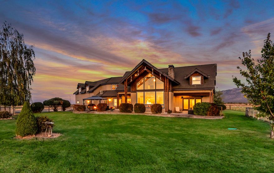 Experience unparalleled Cascade Mountain views from this 39-acre Powell Butte estate. This 4,349 sq. ft. custom home features 5 bedrooms, 4 bathrooms, a large bonus/family room, an office, and a stunning rock fireplace. Recent updates include Energy Star windows, refinished hardwood floors, new carpet, a heat pump, exterior paint, garage doors and openers. With 31.57 irrigated acres in the Central Oregon Irrigation District, this property is perfect for agriculture or equestrian pursuits. The barn includes a tack room, overhead hay storage, and covered feeding area, along with well-maintained corrals. A paved driveway ensures convenience and accessibility.