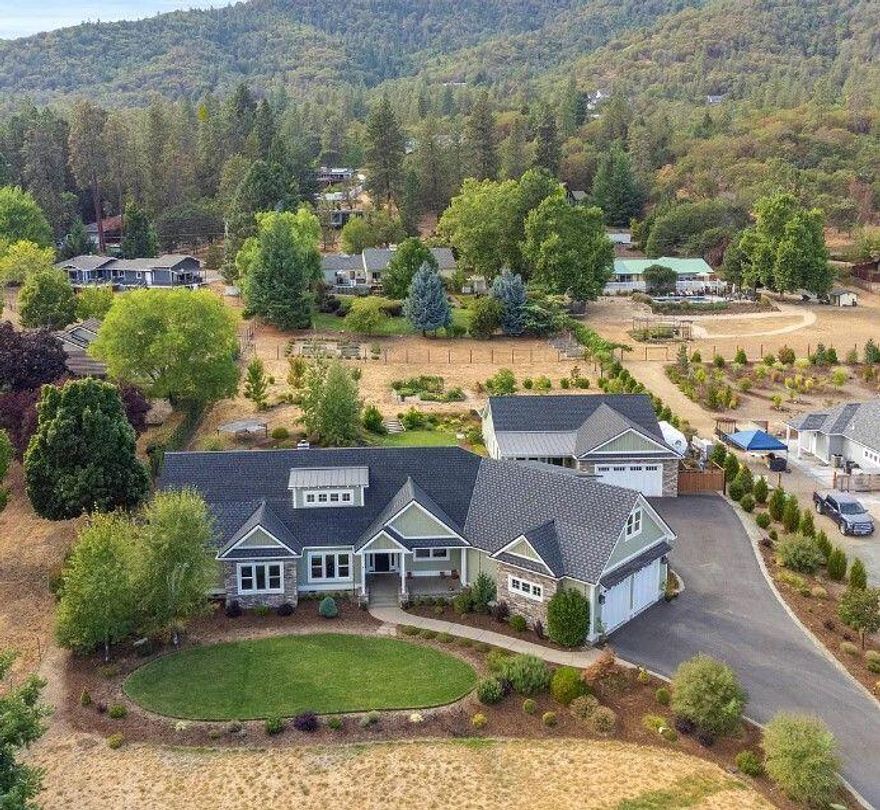 Discover the epitome of luxury and practicality in this 3-bedroom, 2-bath home, personally crafted by the builder in 2017. Set amidst the unparalleled beauty of Mt. McLoughlin and located in the highly sought-after Jacksonville school district, this home offers the best of both worlds. From meticulously maintained landscaping with an automatic irrigation system to an elegantly lighted driveway, every detail has been considered. The interior boasts walnut flooring, granite countertops, and chic vessel sinks, not to mention a linear propane fireplace that adds a touch of modern warmth. The home also offers a flex third bedroom or study, an oversized garage spacious enough for 3-4 cars, and 1,031 additional sqft pre-approved for expansion. But that's not all—this property also comes with a matching 1,000 sqft ADU, perfect for generating extra income or hosting extended family. It's not just a home; it's an extraordinary lifestyle opportunity awaiting your arrival.