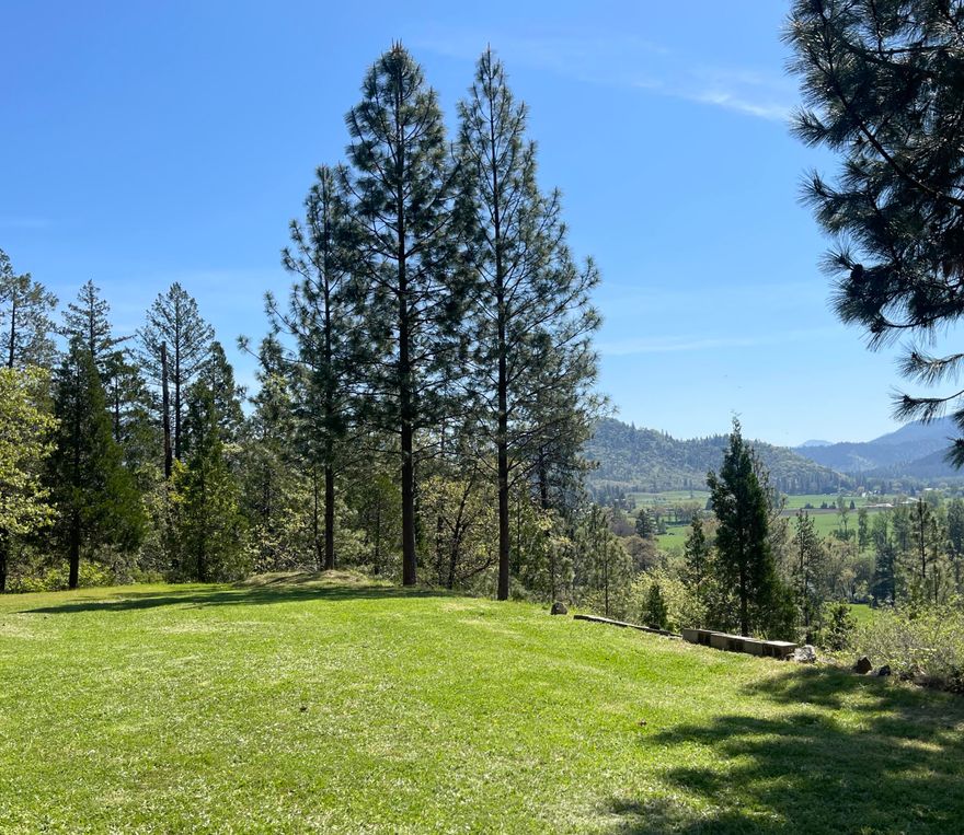 STUNNING VIEWS of the Applegate Valley, River and Mountains. Set on a private 5ac lot with spectacular views, this 3/2 1540sf home features an open floorplan that acentuates the views. New updates include; kitchen cabinets, Island w breakfast bar & sink, granite countertops, sinks, fixtures, appliances, engineered wood plank flooring, garage & entry doors. Lots of homes can be redecorated, updated, or remodeled to the buyers desires, but you can't change the location they sit on. Having this view everyday you walk outside, or to the edge of the lawn, is like stopping at a scenic viewpoint on vacation. You can play football with friends, plant a garden or relax in privacy on your expansive front yard. Minutes away are 3 County Parks with picnic areas, trails to hike, bike, walk dogs, ride horses and rivers to swim & fish. Broker is related to Seller. Price has been reduced to sell. Home will be move in ready before COE. Price is firm. *Driveway is not suitable for large trailers, RV's.