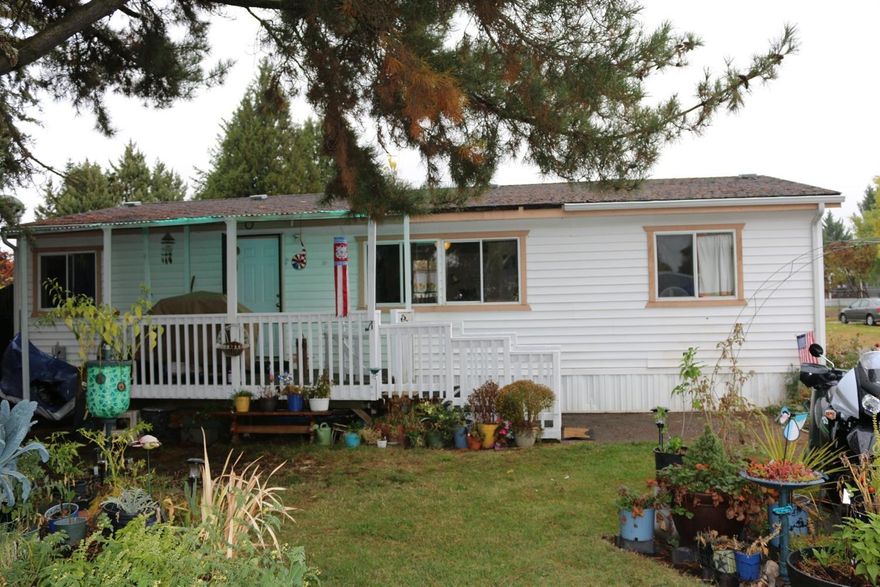 Conveniently located & affordable 3 bed/ 2 bath move in ready manufactured home in quiet cul-de-sac in Aloha Sun Mobile Estates. Home has split floor plan with many upgrades which include new flooring, new interior paint and much more. Plenty of room in front yard for gardening with mature trees provide plenty of shade for hot summer days. Large covered front porch/patio provides ample space for BBQ's with friends and family. Property sold as-is. Park rent includes water, sewer, and garbage/recycling. Clubhouse and gated & locked trailer/RV parking available by reservation. Buyer must be approved by park management.