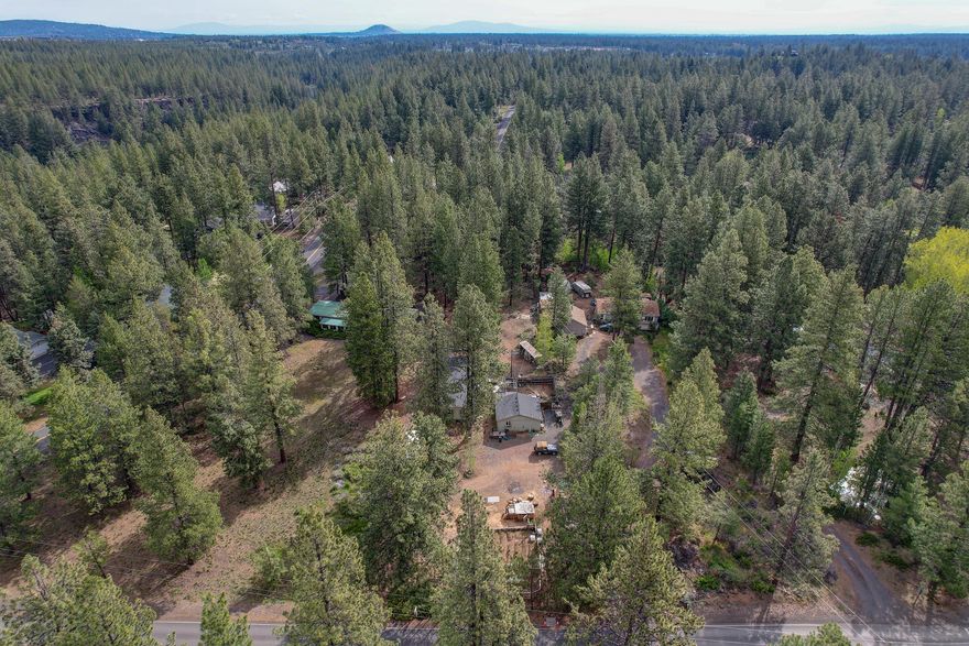 Rare Opportunity:  Cute cottage home on a (nearly) one acre homesite under $400K! The existing 1-bedroom cottage is perfect for simple living, or as a vacation home... or as your ''base camp'' while you build your new dream home. The Location:  all paved roads lead to this beautiful forested lot sited close to the Deschutes River, while being just minutes from Bend's Old Mill District (concerts/events, restaurants & shops), Mt. Bachelor & the Cascade Wilderness Area, hiking & biking trails, and all the rest of Central Oregon's recreational amenities. Plenty of room to add an RV garage/shop, grow a garden, or tend to your chickens! *Concrete septic tank and new hook-up to Agate water; old manufactured home in process of being removed.