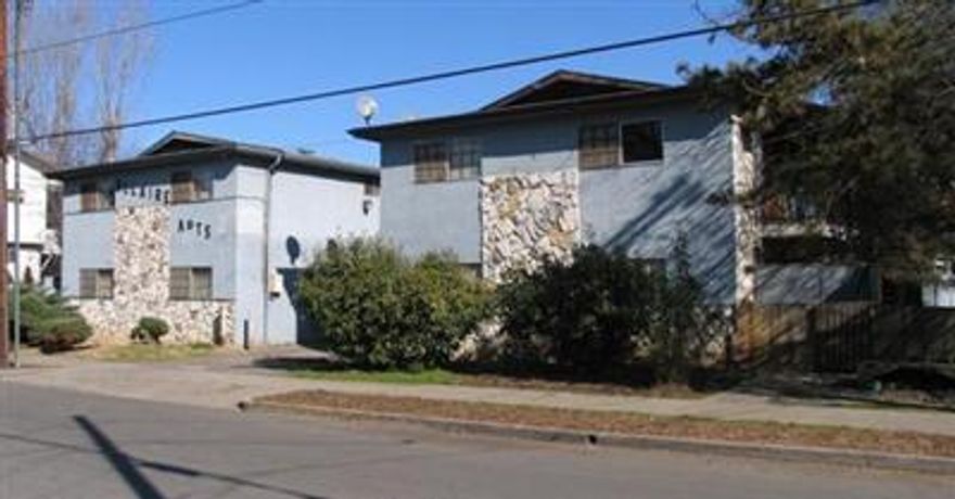 The subject property is a 24 unit complex with a common driveway between the two buildings. Each building has 12 units of which 6 units are 1 bedroom, 1 bath, and 6 units are 2 bedrooms, 1 bath. The parking is in the rear of the property with carports and storage along the outside property lines. The buildings are two story with stucco exterior and composition roofs. The units are single level flats. Each unit has a refrigerator, dishwasher, range/oven, washer & dryer, electric baseboard heat and wall air conditioner. Most units have vinyl floors.