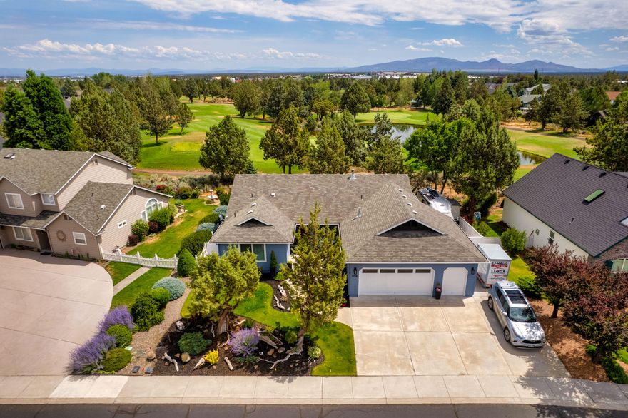 OPEN HOUSE, SAT 8/9, 1-3PM! With one of the best locations within the Greens at Redmond community, this thoughtfully updated home has unbeatable golf course views and a comfortable, light-filled layout. Perched above the 4th green with sweeping views of the fairway, lake, and the 5th fairway and green beyond, the setting is nothing short of serene.. Fresh and modern vibes with new carpet, new  paint, laminate flooring, updated bathrooms and tons of windows that fill the home with natural light. Single level living features 2 en suite primaries, walk in closets, expansive course views and a 3rd bedroom that can flex into den/office space.Gated RV parking with RV hookup and dump, central vacuum system, mature and stylish landscaping and a large deck overlooking the course are just a few more of many features. This is a rare opportunity in one of Redmond's most sought after golf communities. Schedule your showing now!