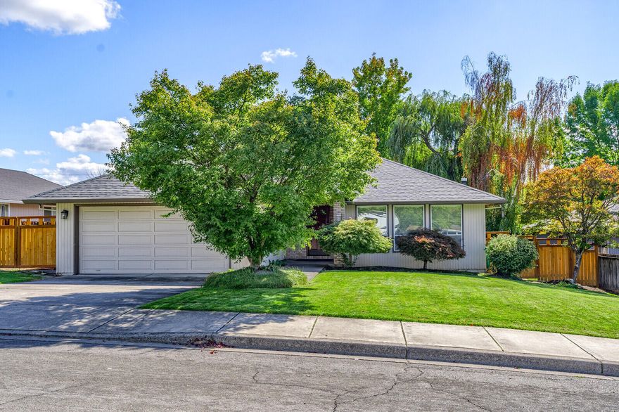Fantastic East Medford home located in a great neighborhood. This home features an open concept, 3 bedrooms, 2 full bathrooms, 1610 sq ft, a lot of natural lighting, tile flooring and was built in 1990. Enjoy the great living room with a gas fireplace and large front-facing windows. Spacious kitchen offers abundant countertops and cabinetry, glass top range/oven, dishwasher, microwave, refrigerator and a window overlooking the beautiful backyard. Dining area has a glass sliding door that leads out to the large backyard deck. Large primary bedroom features a glass sliding door that leads out to its own private deck, two very large closets and attached ensuite bathroom with sink & ample counter space, cabinetry, large shower and window. Peaceful backyard with privacy, mature landscaping, large lawn area, 2 decks, fencing, sprinkler system & shed. Attached 2 car garage with cabinetry. Wonderfully located in the Lone Pine/North Medford school district. This home is move-in ready.