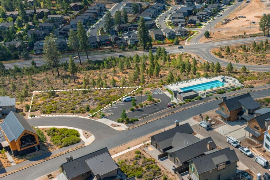 Perched atop a south-facing ledge, this property boasts sweeping views from sunrise in the east to the Cascade Range in the west. Build your dream home to bring those stunning sights indoors. Outdoor adventures await with easy access to Phil's Trail at the base of the property and easy access to the Deschutes National Forest and Deschutes River. The Tetherow homeowners-only pool adjoins the lot, giving you all the benefits without the upkeep. Walk to Tetherow Sport, restaurants, and the year round pool. Mt. Bachelor and all that Bend has to offer within easy reach. Enjoy a round of golf on Tetherow's stunning links-style course before capping the day with a sunset view over the mountains.