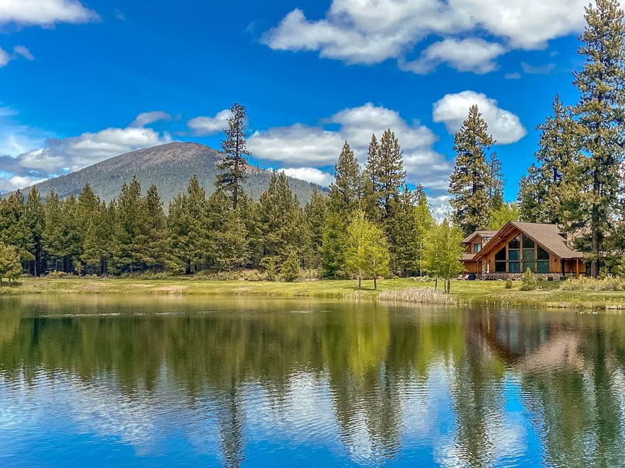 Discover a once-in-a-lifetime opportunity at Spirit of Winter Ranch, featuring 83 acres surrounding the stunning Spirit of Winter Lake, embraced by majestic ponderosa pines. Just 10 minutes from Sisters and 30 minutes from Bend, this exclusive retreat borders Black Butte Ranch, a premier resort. The property offers breathtaking views of the Three Sisters, Mt. Washington, and Black Crater, framed by snow-capped peaks. The lodge showcases timeless Western style with oversized tamarack logs and rare myrtle wood flooring. Inside, enjoy a grand great room with a colossal fireplace, a gourmet kitchen with high-end appliances, and three ensuite bedrooms, along with an entertainment room and office. The 5 acre lake, stocked with rainbow trout, attracts diverse wildlife, while a 4,800 sqft barn includes heated facilities and access to the Metolius-Windigo trail. Experience unparalleled privacy, luxury, and nature in this exceptional dream property. See spiritofwinterranch website for video.