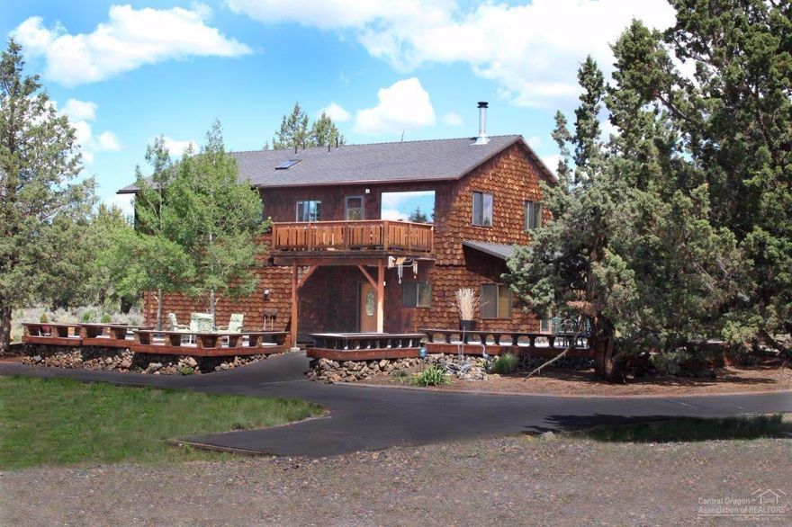 Lovely Cedar Shingle home on a private 2.49 acre lot. Great Room Living with magnificent view of the Three Sisters. Hot Tub included, 7x19 Sun Room. 23x23 downstairs den/fam Room. Master suite. Office. Expansive Trex decking. Attached 2 car garage. Detached 27 x 27 heated/insulated shop with garage door & bathroom. 10x12 storage barn. Large fenced kennel area with shed. Invisible Electronic Fence around entire 2.49 acre property. Washer, Dryer, Fridge Included. 1/4 mile to BLM for great hikes! Avion Water