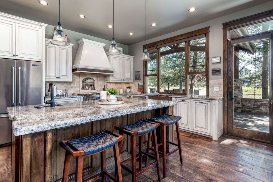 Custom High Timber Construction built home w/ golf course views! High end finishes throughout. Gourmet kitchen includes granite counters, copper sink, gas range, warming drawer and Miele coffee station. Great room has stunning beams w/ metal brackets, wood burning fireplace w/ floor to ceiling stone, hardwood floors & vaulted wood ceiling. 3 suites w/ private baths, a bunk room w/ private bath plus a large bonus room w/ wood ceilings, a wet bar for entertaining and deck. Primary suite includes gas fireplace, wood floors, wood ceiling, large walk in closet w/ optional lock off, heated floors and soaking tub. Enclosed courtyard overlooking the golf course w/ built in BBQ, granite counter w/ passthrough to kitchen, gas fireplace, paver patio, hot tub & fire pit. Spacious mud/laundry room w/ sink, 1 washer & 2 dryers. 3-car garage w/ built in cabinets, storage room & 3rd bay lock off. Zoned heating, A/C, wood windows, central vac, new exterior paint, sold furnished.