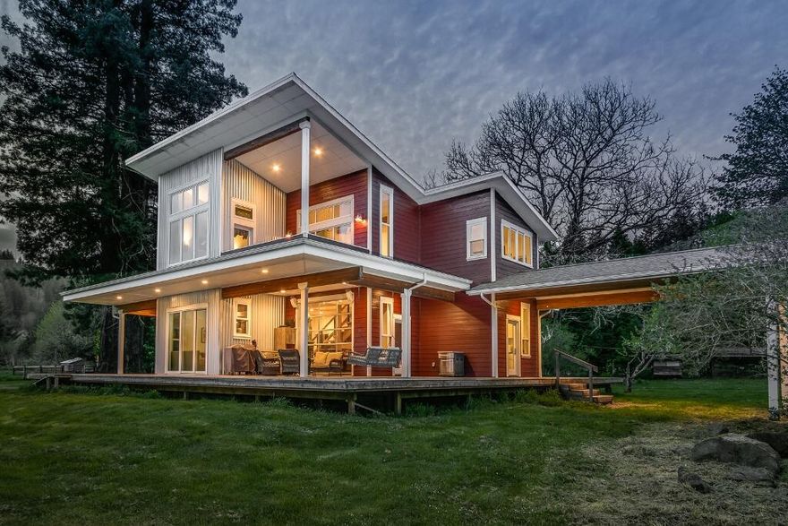 Riverfront Nature Conservancy Farm & Fishing Retreat just 8 miles by boat on the Siuslaw River to historic Old Town
Florence on the Oregon Coast & 24 miles by car. Nearly 1 mile river frontage & a private dock. Custom Farmhouse built in 2016 w/
modern twists, Tulikvi woodstove, glass roll up garage-style door & ber optic internet! Old growth, spruce forest & equestrian
amenities with barns, a covered arena, a studio, & approximately 23 ac of organic pastureland. 53 miles to Eugene Airport.