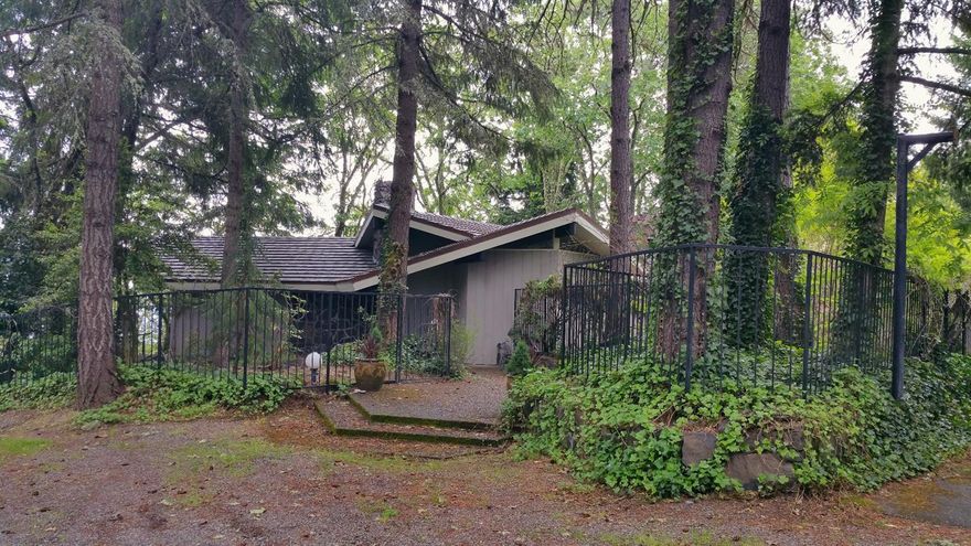One of a kind Gem in beautiful Southern Oregon. The 2680 sq. ft. home perches on top of a ridge with gorgeous views of the valley and city below. Built in 1963 but way ahead of its time with class and elegance. Parquet wood and exposed aggregate flooring set this home apart. 3 bedrooms, and office AND a hobby room along with 2.5 baths offer you great versatility. Outside entertaining is a breeze with the refreshing, beautiful in ground pool. Parking is an attached 2+ car carport. All information is deemed reliable but not verified. Anyone considering purchasing this property should perform their own investigation into the uses and condition of the property.