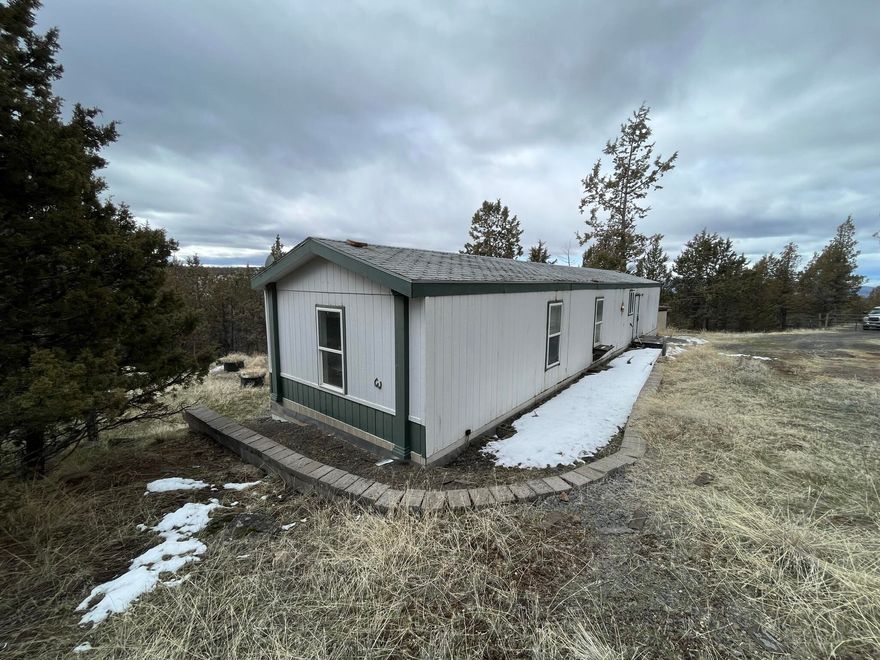 Private location only 9 miles from Prineville Reservoir State Park.  Single wide on 1.39 acres with 3 bedrooms, 2 baths and 1056 sq ft.  Property is gated and fully fenced.  Here is an opportunity to add your personal touches to an affordable recreational retreat or make this your full-time home!  Sold as-is.
