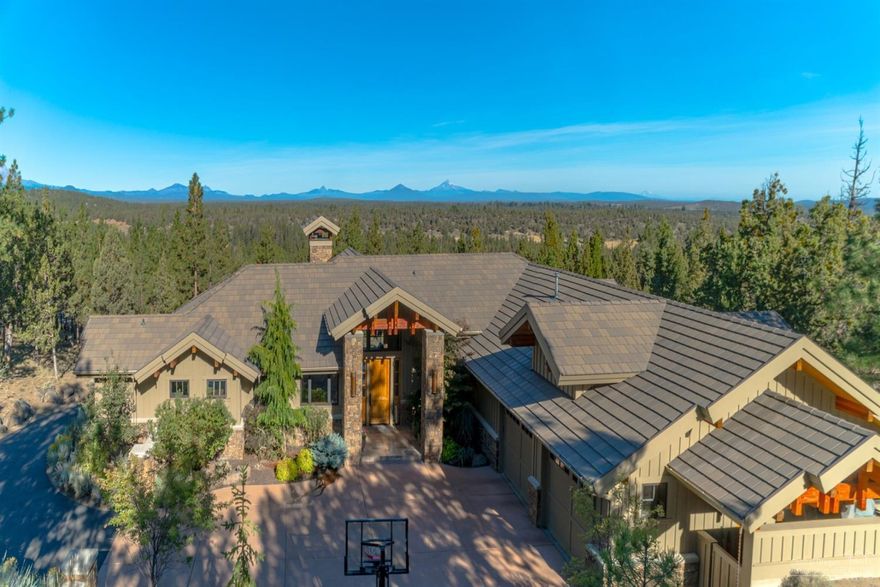 This spectacular home sits on a 1 acre parcel in the gated and established community of NorthRim! Enjoy a thoughtfully designed floor plan with a large gourmet kitchen, w/warming drawer, wine coolers, built in refrigerator, built in cabinetry & amazing views from the dining area. The formal living area has a Montana moss rock fire place & NW style chandeliers. Also on the main level are two master suites, office, utility room, mud room, large pantry & an oversized heated 3 car garage. The lower level boasts 2 bedrooms, 2 full bathrooms, downstairs laundry room, 2nd living room, wet bar, game room & 1+ garage space with options of expanding. The outdoor space provides a large deck overlooking the beautiful Central Oregon landscape & northwesterly views of the cascade mountain range!