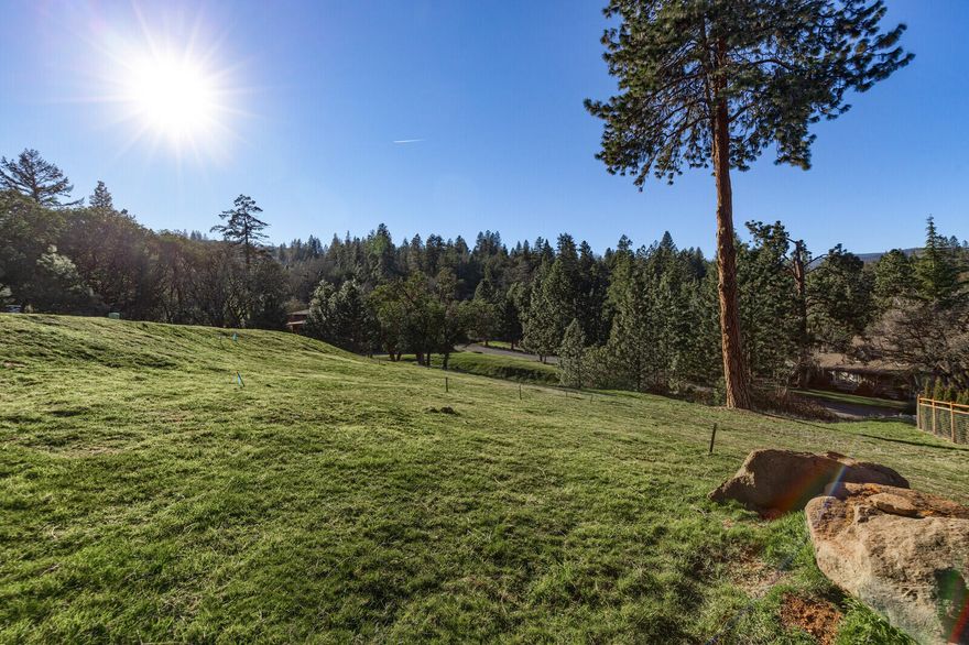 Rare find minutes from downtown Historical Jacksonville in an area of luxurious homes! Fabulous views of the Valley, City Lights, Table Rocks and beyond. Beautiful large .61 acre lot available with all city services including cable and natural gas. Building envelope was increased to utilize a custom 4100+ square foot home. Existing Engineered Building Plans are available for purchase, if desired.  Listing agent related to builder.