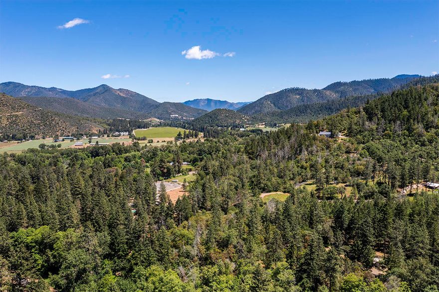 Incredible $56,000 Price Reduction for Quick Sale!  All the work has been completed to prepare this 8.97 acres for your dream home or new MH.  The property has homesite, power, excellent producing well (per seller), and septic already in place. Located in the heart of Applegate Wine Country where every day feels like vacation. The tranquil setting is complete with the gurgling creek, chirping birds, and refreshing scent of the pines. This beautifully wooded acreage features Ferris Gulch Creek running through it, with cleared, level areas that let the sunshine pour in. Enjoy gently rolling terrain with level, usable areas, and neighboring BLM land. A paved road leads right to the driveway. MH of no value is currently on-site to hold the homesite with Jackson County. Estimated cost to remove MH is $8000-$10,000. 
Don't miss this unique opportunity to build your dream home or place a new MH in one of the most picturesque areas of Applegate Wine Country!