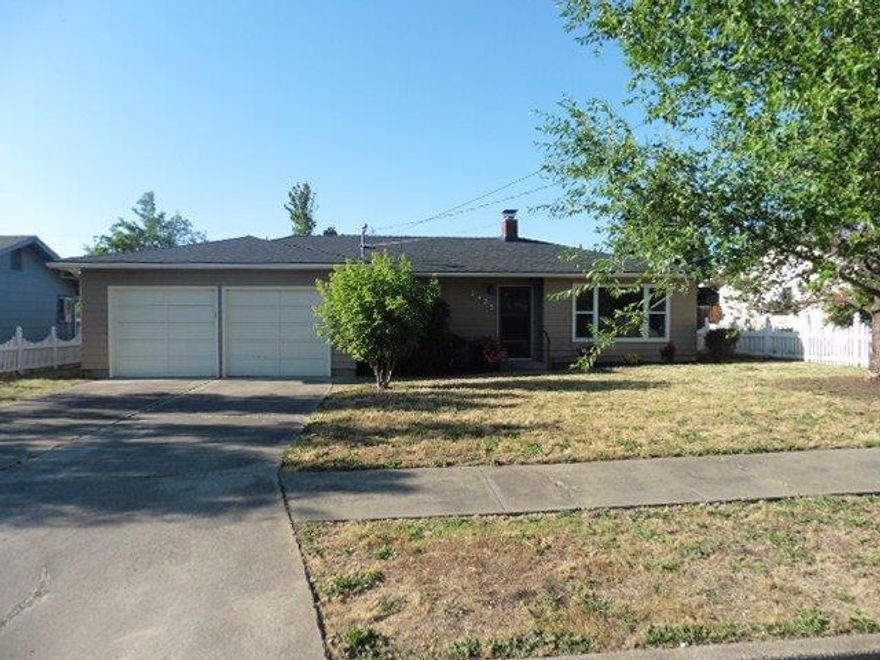 Wonderfully updated home on a quiet East Medford street situated on a large lot. Huge backyard offers lots of room and a large partially covered deck. Step inside this 3 bedroom 2 bathroom home that offers updates including interior paint and flooring throughout. New counters/back splash, cabinets and new stainless applainces in the kitchen. The large living room offers tons of natural light and a fireplace and the bathrooms have been updated. New doors and fixtures throughout. Home includes a new roof as well. This place really shines!