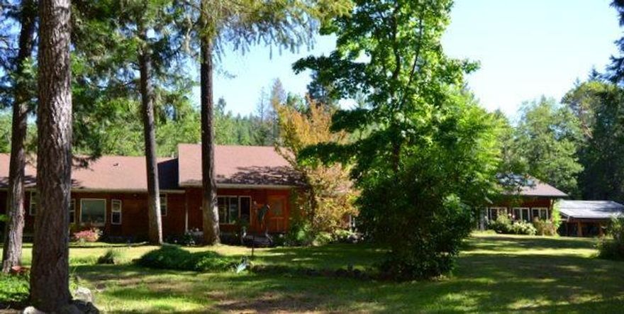 Private, Peaceful, Perfect. This home sits in a park like setting with beautiful forest acreage behind, and pasture area at the front of property. House features New interior paint, New carpet, vaulted living room ceilings, rock fireplace, 3 bedroom 2 baths with an additional room previously used as movie room or could be a family room. Exterior has a lovely front/side wrap around deck with koi pond and waterfall. Backyard features water wheel, large patio area and small greenhouse. Detached pool house with an amazing pool,spa and sauna. Interior of the pool room feature open beams, skylights, and rock fireplace. Pool and spa are heated by wood stove and solar. From the porch of the house you can view the gazebo and dock on a large pond. Pasture area is fenced and cross fenced. Workshop building located close to pastures. Must tour to appreciate.All information deemed accurate but not guaranteed; buyer to perform their own due diligence.