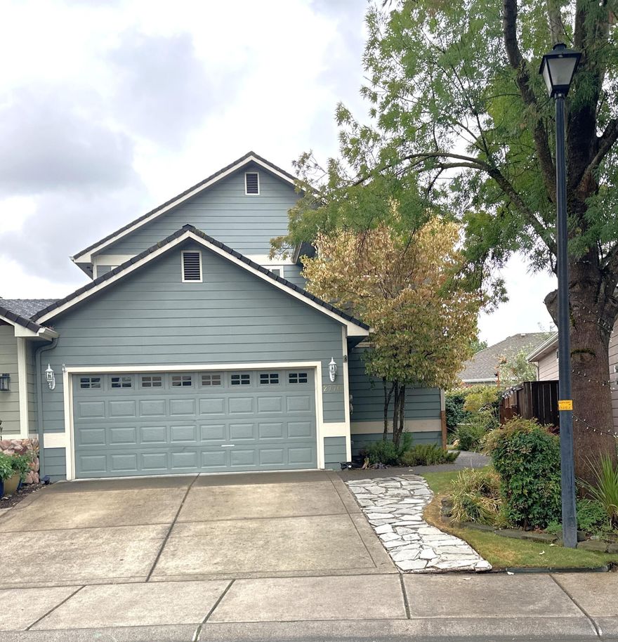 Super cute and clean townhome in Central Point East!  Primary bedroom is downstairs  with en-suite bathroom.   Cathedral ceilings in great room which is open to kitchen featuring granite countertops and hardwood flooring.  Upstairs you'll find a secondary large bedroom, loft and 2nd washer/dryer hookup area.  Other hookups in the double car garage that also features more under stair storage. Backyard is low maintenance and front yard is maintained by the small HOA.