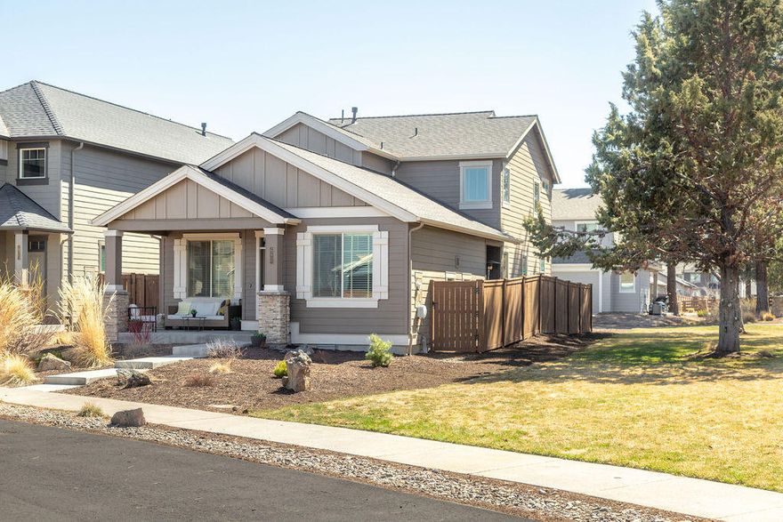 No doubt with the master on the main level this is one of Pahlisch Homes most sought after floor plans, and coupled with it being in the highly desirable Bridges Community, it's a win-win. What makes this home even more special, it's situated on an end lot, tucked up under mature trees and against a beautiful manicured lawn (maintained by the HOA). This home has all the bells and whistles that one expects from a quality builder; quartz counters, knotty alder cabinets, SS appliances, and LVT flooring (looks just like hardwood but wears like laminate) on main level. This home offers extra touches like tile floors in the utility room & bathrooms, coffered ceilings, walk-in closets in all bedrooms, & helpful folding counter in the utility room. Built in 2017 it feels brand new and is within walking distance to all the great amenities The Bridges is known for: pool, workout facility, clubhouse & more! For added recreation, the new 37 acre Alpenglow Park is going in right across the street.