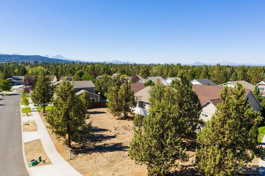 This is a wonderful opportunity to buy a lot and have a home built to suit your exact needs by one of Bend's best home builders, Ross Built Homes, LLC. This is a fantastic location in a newer neighborhood close to Costco, St. Charles, and the new food cart lot. This family friendly neighborhood has just a few lots left, stop by and walk the two properties with our signs on them and call with questions.