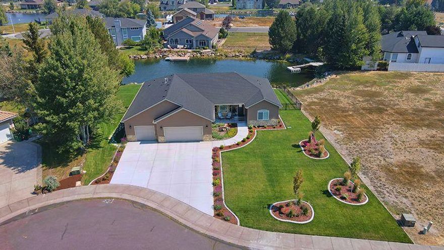 Looking for perfection? No need to build! This home is like brand new! Only a little over 2 years old. Move-in ready! Custom 4 bed and 3 bath home w/an open floor plan in the prestigious Harbor Isles community. Kitchen has beautiful custom cabinets, granite countertops and tile backsplash, high-end stainless-steel appliances. It is perfect for entertaining. This home has abundant storage. This fabulous home has a split floor plan with two master suites, walk-in closet, and lovely master baths with granite countertops and custom cabinets. Great room has a fantastic view of the water and the nearby hills. Gorgeous landscaped yard with inground sprinklers and drip irrigation system. Fenced waterfront backyard ideal for kayaking, canoeing, and fishing. The home is on a cul-de-sac near the Pro-shop and restaurant (The Clubhouse at Harbor). In the opposite direction there is the fitness center and the local Yacht Club. It is close to the hospital and OIT.