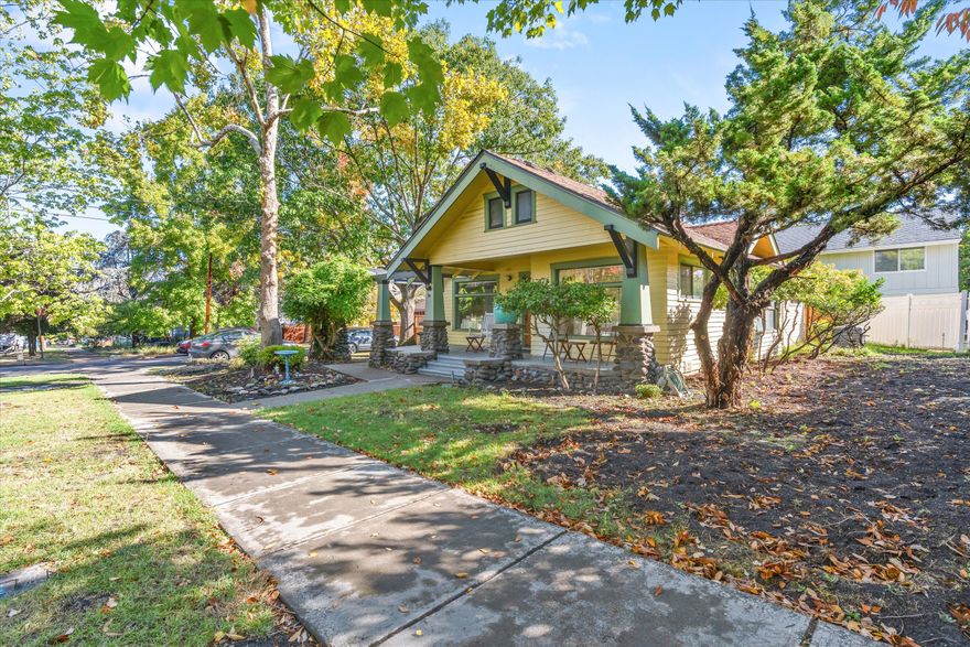 Fantastic downtown Ashland location with curb appeal!  This 2- bedroom, w/den-office & one bath, home is cozy and provides ample room for storage and living space. Enjoy sitting on the deck in the mornings with mountain views!
Owner has invested in the last year in a brand-new beautiful deck along the home, new gates and fencing, FP insert, newer HVAC system and all brand new ductwork and insulation making this home very energy efficient and new sprinklers. Recent upgrades include new electrical panel, flooring in many of the rooms, new interior paint throughout and a new roof in 2022. This 1920's vintage Craftsman home is located in Ashland's famous Historic District and just a few minutes' walk to the plaza. You will find shopping, fine dining, the Oregon Shakespeare Festival, Oregon Cabaret Theatre, & Lithia Park all easily accessible. There is a liability insurance fee for the small HOA ($190/annually) that also provides 2 parking spaces towards back of the property