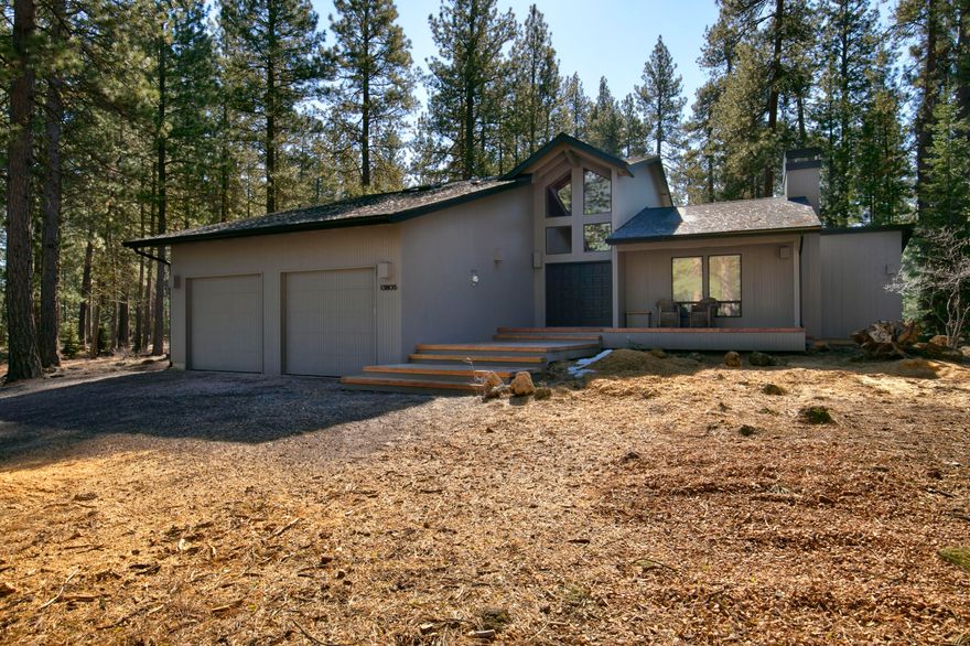 Perched on a gentle bluff, EM 25 offers a serene retreat with privacy and breathtaking forest views, plus direct access to hiking trails from the backyard. The front porch provides a lovely view of Black Butte. Inside, the main floor features a cozy living area with wood-burning fireplace & sliding doors to a patio with a hot tub, seamlessly flowing into the dining area. The spacious kitchen is ideal for cooking & features an island breakfast bar. There are 2-bedrooms, one with patio access, & a bathroom with a stall shower, along with a utility room that includes a toilet & sink. The second floor is dedicated to the primary bedroom, which boasts a separate tub & shower, along with a large walk-in closet. The 2-car garage is set up for recreational activities like ping pong & bike storage. Residents enjoy amenities such as 2-golf courses, tennis & pickleball courts, six pools, hot tubs, fitness rooms, a spa, & three restaurants. Recent upgrades include a new roof, fresh paint & more.