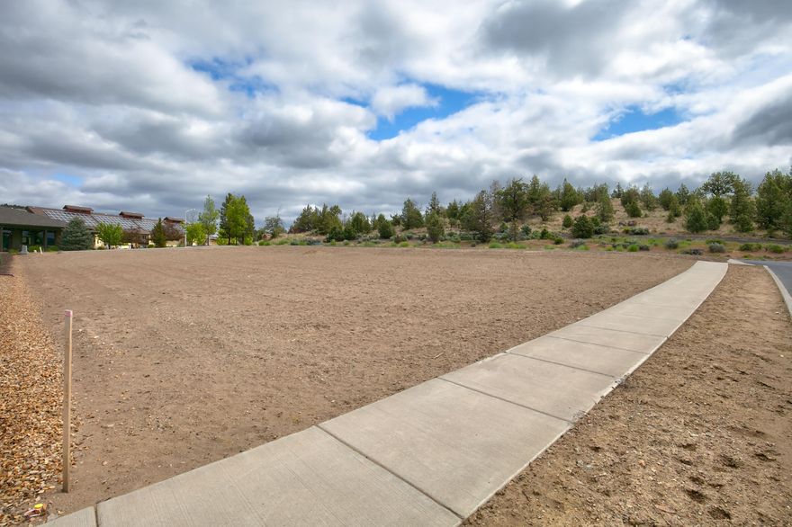 Discover an exceptional 0.24-acre lot in the coveted IronHorse community! This spacious property features alley access and utilities stubbed to the lot, ensuring a smooth start to building your dream home. Just steps from the Barnes Butte trail system, it's perfect for hiking and outdoor enthusiasts. Enjoy the ideal mix of seclusion and convenience, with Prineville's shops, dining, and schools nearby.