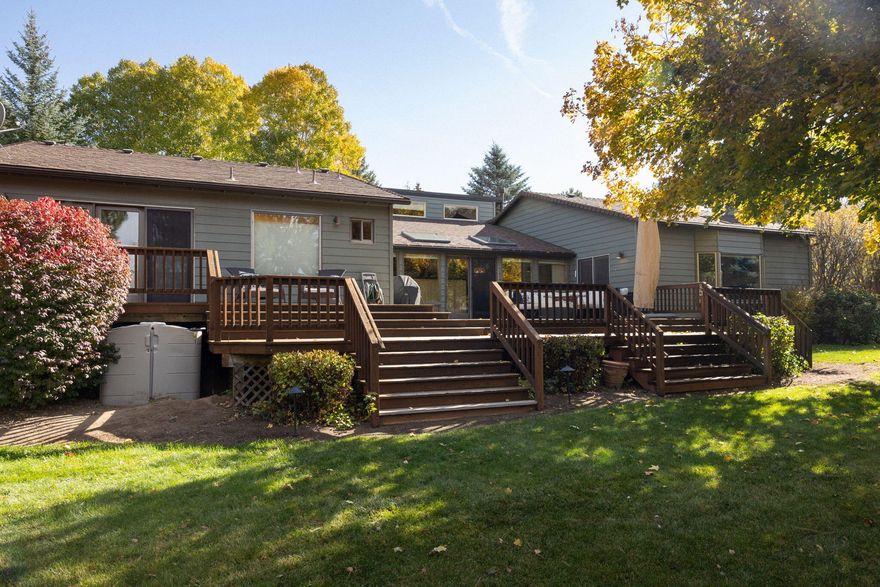 A hidden gem in a prime SE Bend location! Step inside to discover a home filled with warmth, character, and updates. The fully landscaped yard offers a private retreat with mature trees, two storage sheds, and a separate office or creative studio. Enjoy slow mornings or summer barbecues on the spacious deck. Inside, vaulted cedar ceilings, a bay window, oak floors, and classic tile counters create timeless charm. Past remodels added a large family room with a second fireplace and a flexible office or den. Recent upgrades include a remodeled primary bath, new carpet, updated flooring, fresh paint, a newer roof, septic, and exterior paint, plus a new driveway, drainage system, refrigerator, and microwave. Move-in ready and beautifully cared for!