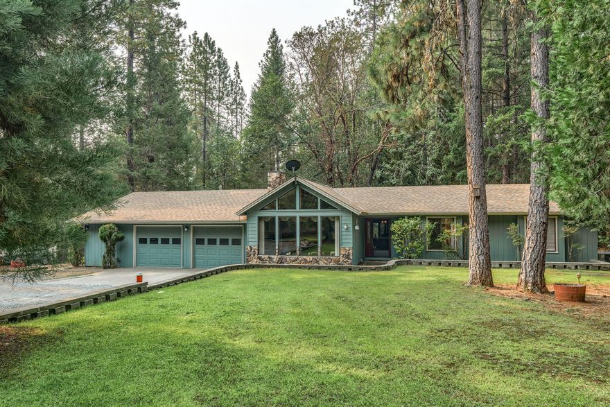 Breath taking ranch style home on 2.6 acres in Rogue River. This home features an open living room, vaulted ceiling with a freestanding gas fireplace, 3 bedrooms, 2 1/2 bath, large laundry room with lots of storages throughout. Master bedroom with skylight and a walk in shower for 2. My favorite place is the 15x15 carpeted in-closed patio with removeable windows and screens.  Great place for family gatherings. The garage is extra wide for 2+ cars connected with a workshop room and plus a hobby room. Outside you have another single car garage or make it your workshop. Lots of RV parking.  Newly built shed for all your garden tools. Front lawn has all inground sprinklers. Manicured landscaping. Relax outside on your swing inside your gazebo listening to the waterfall. New roof this year.  Freshly painted throughout. Property backs up to Woodland Reserve.  Great tasting well water.  Take a tour of this property and you will fall in love.
