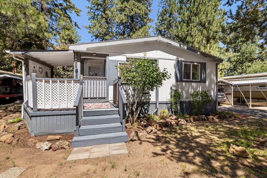 Tucked into the heart of Romaine Village, this move-in ready home offers comfort, privacy, and value in a convenient Bend location. Inside, you'll find an open floorplan with spacious bedrooms, full bathrooms, and fresh interior paint that gives everything a crisp, clean feel. Brand new carpet and a new stove add modern updates, and all appliances are included—just bring your toothbrush! Enjoy the comfort of A/C in the summer, plus the practicality of a covered carport and two outdoor storage sheds for all your gear. Out back, a newly built wood fence creates a private space to unwind or entertain. Come check out this gem that balances affordability with function and style!