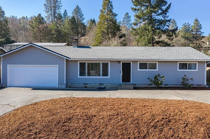 You are going to love this house! In a well-established NW neighborhood, you'll be amazed by all the upgrades in this three bedroom/2 bath, 1460 square foot beauty. Made lighter and brighter by new dual pane windows, gleaming wood floors set off a gorgeous custom-designed kitchen with granite counters, beautiful shaker-style cabinets and stainless steel appliances, including a gas range. Beautifully updated baths, tile floors and indoor laundry. Nice fenced backyard features a covered patio and a lovely shade tree to keep things cool. Don't wait!