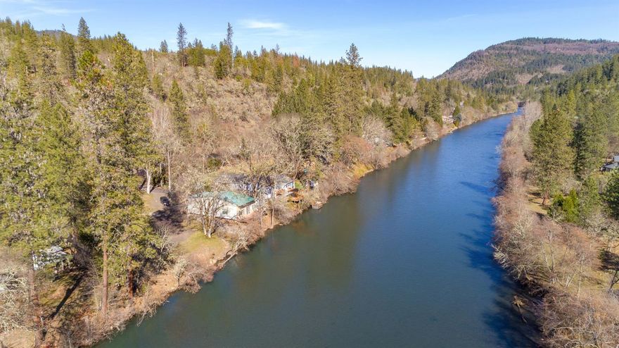 Rogue Retreat - build your dream home here! Unique .60-acre with 178-ft of Rogue River frontage w/water rights. 816-Sq. ft. shop finished & furnished with 1-bedroom, 1-bathroom, kitchen and beautiful deck overlooking water. Plus, approved building pad with water and septic installed. Bonus is boat ramp and sale includes yard tools, lawn mower, pontoon floating dock w/trailer and more. Catch steelhead and salmon from the river bank! Call for list of all inclusions.