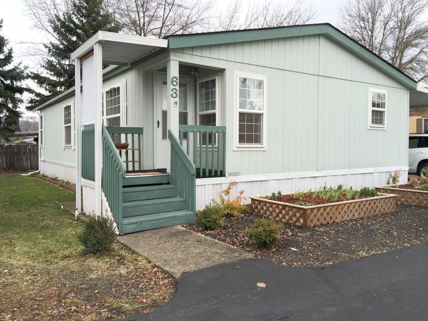 Very clean, well maintained home in the 55+ Candlewood Park. This 2 bedroom 2 bathroom home is 1296 Sq. Ft. with an extra retreat off the master bedroom. The home has vaulted ceilings and newer carpet throughout. The kitchen is open with lots of counter top space and has a new refrigerator and stove. The master bedroom has a large walk-in closet and an updated walk-in shower in the master bathroom. Outside there is a new privacy fence, new 4 X 8 raised flowerbeds in the front for easy gardening and additional water system for sprinklers/drip system. The backyard is large and there is extra storage in the 8 X 5 shed at the end of the 2 car carport. The home has double paned windows, new interior paint, large laundry room. All mini blinds are included and this home includes the washer and dryer.