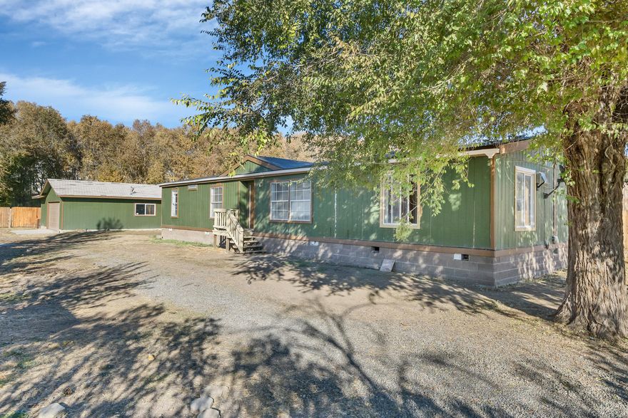 SOLD AS IS**** Seller will not perform any repairs**Nestled right in town is this .49 acre lot with a double wide mobile home and a large 20x40 shop on it. Close to park, grocery stores, restaurants, breweries and much more.
R4 zoning will allow up to a 6 unit apartment or professional office use (check with city planning).