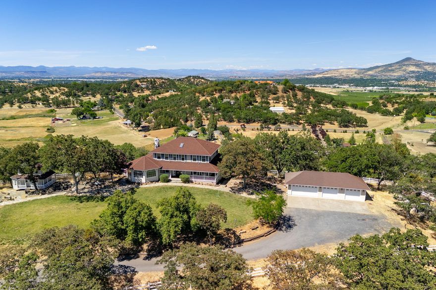 Southern Oregon Dream Ranch! Barn/shop, Playhouse & detached office w/loft space & slider & 4 car garage. Home sits up on a knoll that has amazing views of the Rogue Valley, & tons of windows to take in the views. Lg sunroom, Library w/ wood stove & built ins, wood floors. Kitchen with Cherrywood cabinet's w/pull outs, slate floors convection oven, 4 door refrige, dual fuel oven. Master on the main level, walk in closet, lg shower, sauna, dbl sinks, French doors to covered deck. Lg family rm upstairs w/2 bdrms & full bathroom w/claw foot tub tile floor and ½ bath. Lg laundry rm with laundry chute & storage. Downstairs would make a great work out rm or office with lots of windows & door to outside. Gated entry.